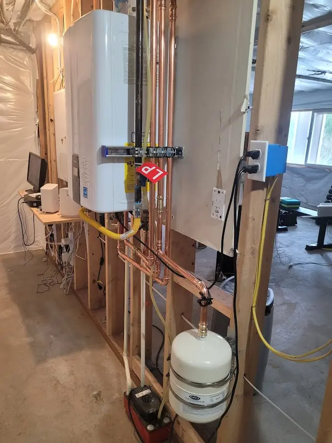 Licensed plumber repairing a kitchen sink in Marlboro